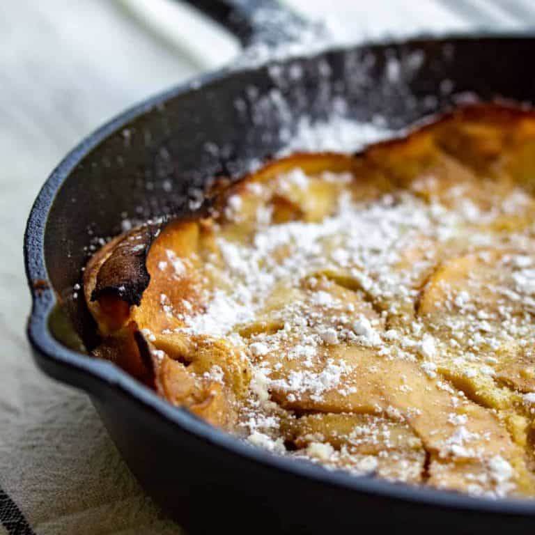 apple pancake in cast iron skillet.