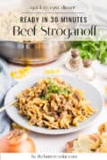 A plate of beef stroganoff garnished with parsley sits on a table with an onion, shredded cheese, and a pot of stroganoff in the background. Text reads Ready in 30 minutes Beef Stroganoff and thebuttercookie.com.