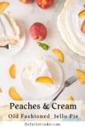 A slice of peaches and cream pie on a white plate, topped with a peach slice, sits next to a fork. The remaining pie, whole peaches, and peach slices are arranged on a white surface with the text: Peaches & Cream Old Fashioned Jello Pie.
